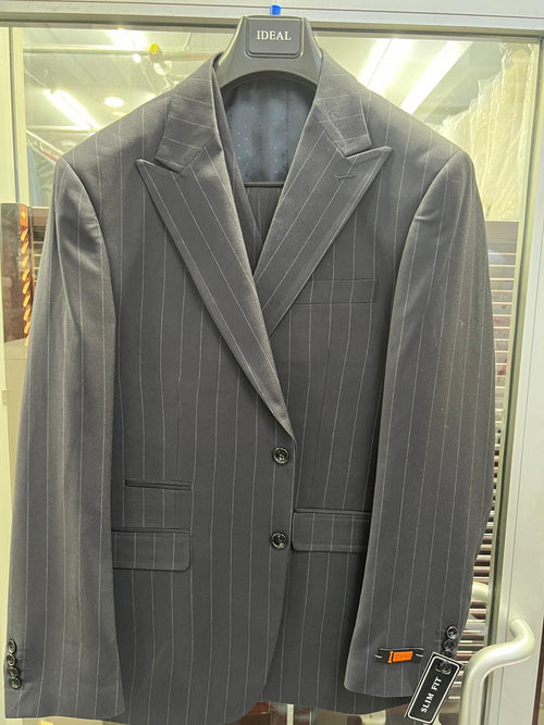 Black pinstripe blazer with dark charcoal stripes. Structured, slim fit, two-button closure, notched lapels, two front pockets. Smooth fabric, black lining with dot pattern. On a hanger.