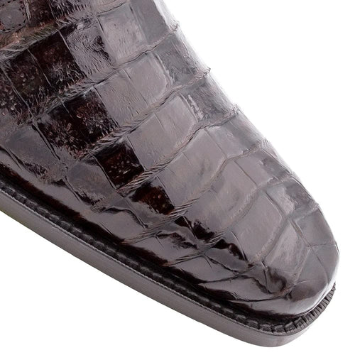 Mezlan Anderson men's exotic lace-up shoes in glossy, dark brown crocodile leather. Features a sleek, pointed toe and unique scale pattern. Smooth edge leads to a flat sole.