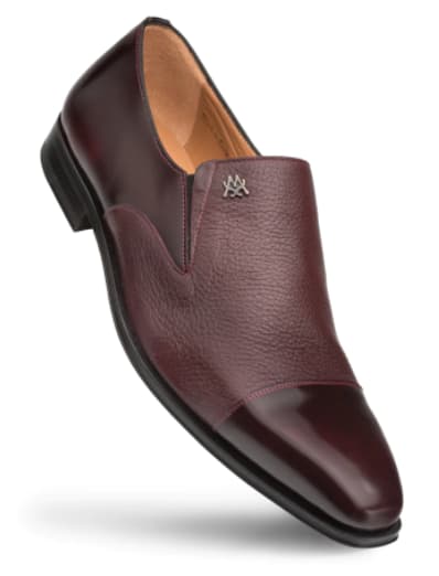 Burgundy calfskin & deerskin slip-on with shiny upper & textured panel. Rounded toe, slip-on design. Beige interior, black rubber sole. Metallic brand emblem.