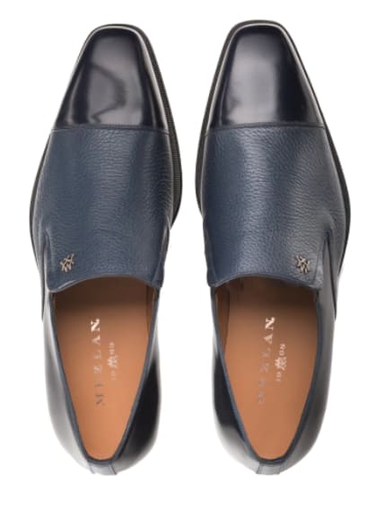 Mezlan slip-on with pointed toe. Blue calfskin/deerskin upper for a two-toned look. Smooth heel, textured front. Subtle side logo. Elegant, structured design.