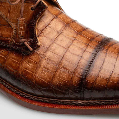 Men's giovane fuscus camel derby shoes. Pointed cap toe, textured camel crocodile leather with scale pattern. Warm brown color, darker accents. Reddish-brown leather sole. Lace-up closure.