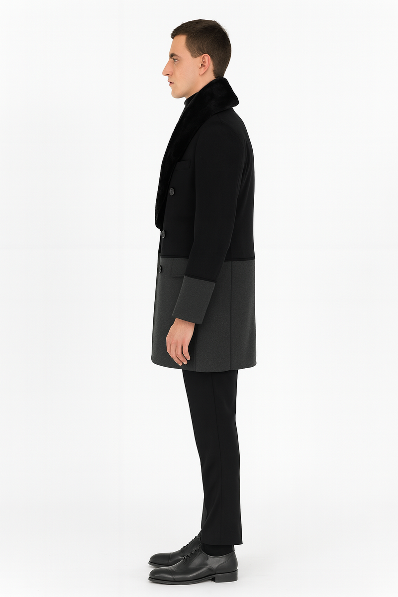 Men's double-breasted wool overcoat. Black upper, grey bottom, faux fur shawl collar, and contrasting cuff details. Structured with two rows of buttons.