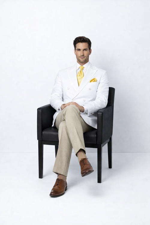 Elegant men’s double-breasted blazer in white features a structured design with dual rows of buttons. It is crafted from a smooth, lightweight material. The blazer showcases a tailored fit and sharp lapels.