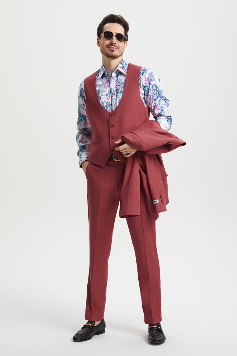 Coral blush pink men's suit. One-button, peak lapel, tailored fit. Includes vest and matching trousers. Solid color, no patterns.