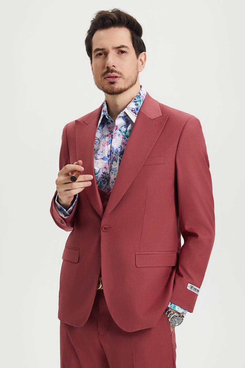 Stacy Adams men's coral blush pink suit. Single-button, peak lapel design with matching vest. Smooth, solid fabric, modern fit, and two front pockets create a sleek, cohesive look.