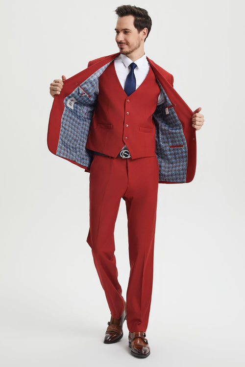 Men's Stacy Adams brick-red suit: two-button jacket, vest, and trousers. Features a patterned blue/white lining. Tailored fit with structured shoulders, straight legs, and a smooth, solid exterior.
