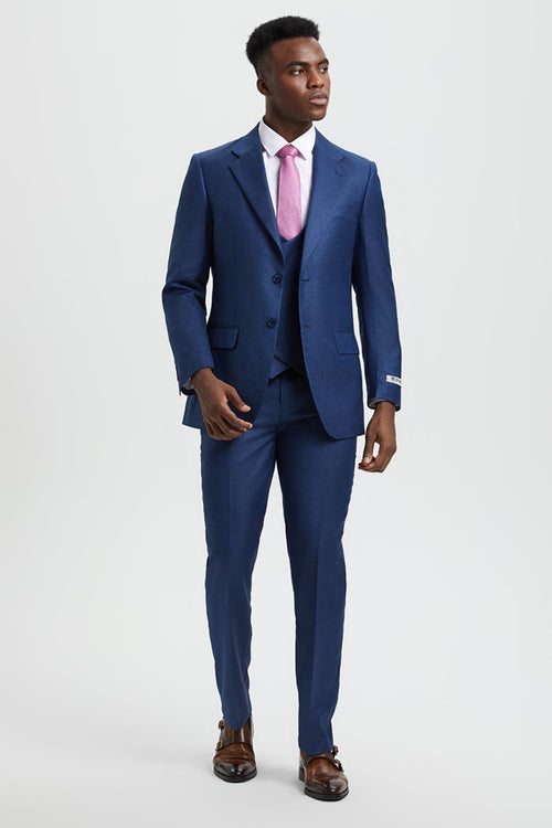 Men's Stacy Adams sharkskin suit: fitted, mid-blue, 2-button blazer with notch lapels, vest, and straight-leg trousers. Subtle texture for a streamlined silhouette.