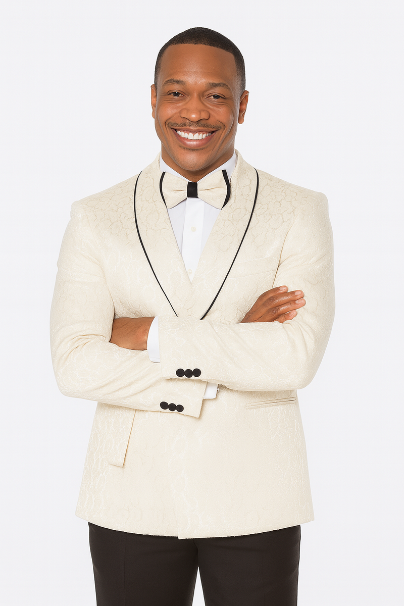 Men's champagne wedding tuxedo. Three-piece suit with light beige paisley. Jacket: notch lapel, black piping, and cuff buttons. Matching trousers.