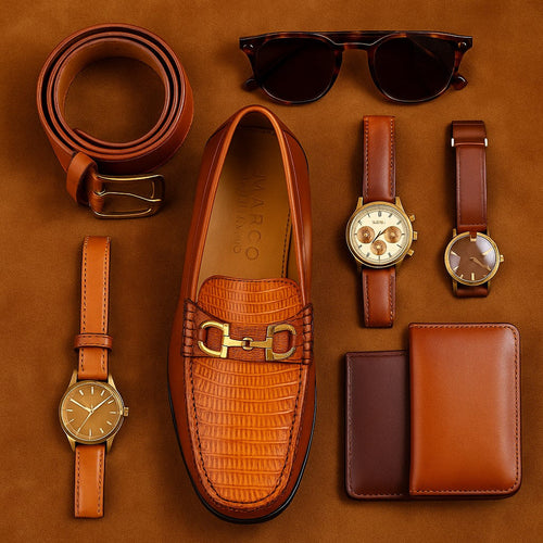 Marco Di Milano Enzo loafers in cognac lizard-embossed leather. Rounded toe, bit strap, and textured pattern. Black rubber sole for structure and stability.