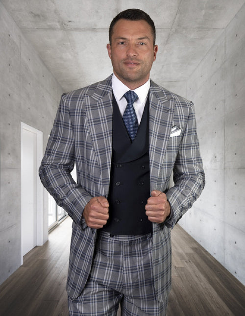 Navy men's classic fit suit with peak lapels, featuring a double-breasted vest. Structured, tailored silhouette in textured navy fabric. No patterns, classic style.