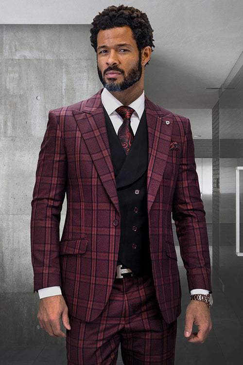 Men's burgundy houndstooth plaid suit. Vested design with wide peak lapel. Includes tailored jacket with buttons, defined shoulders, and matching trousers. Vest in contrasting solid color. Formal, well-tailored.