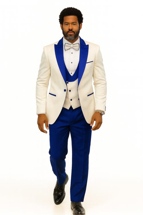 White jacket with royal blue paisley lapels & matching shawl vest. Royal blue pants. White bow tie. Tailored fit, peak lapel, structured shoulders.