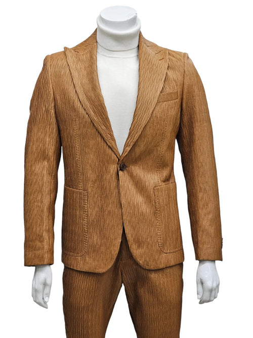 Men's tan vegan leather suit with peak lapel, single-button closure, and patterned texture. Features a sharp silhouette with two front pockets.
