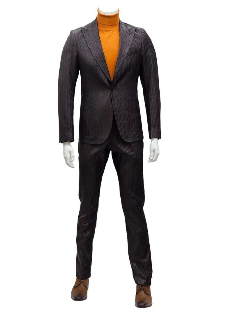 Brown slim-fit suit with peak lapels, one-button closure, and pinstripes. Features matching fitted trousers. Includes orange turtleneck. Color scheme: brown & orange.