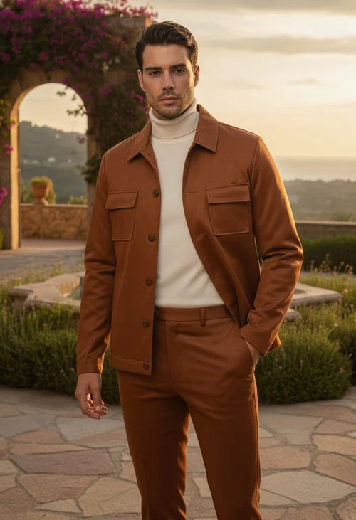 Men's brown faux leather slim-fit suit. Includes a button-up jacket with pockets and flat-front trousers. Tailored jacket, smooth finish. Casual wear.