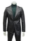 Men's black slim-fit suit. One-button jacket with notch lapels, textured finish, and visible seams. Matching tailored pants.