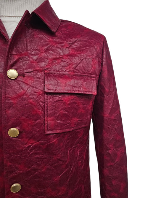 Burgundy faux leather suit. Slim fit, two-piece. Wrinkled texture. Collared jacket with single chest pocket and gold-tone buttons. Casual style.
