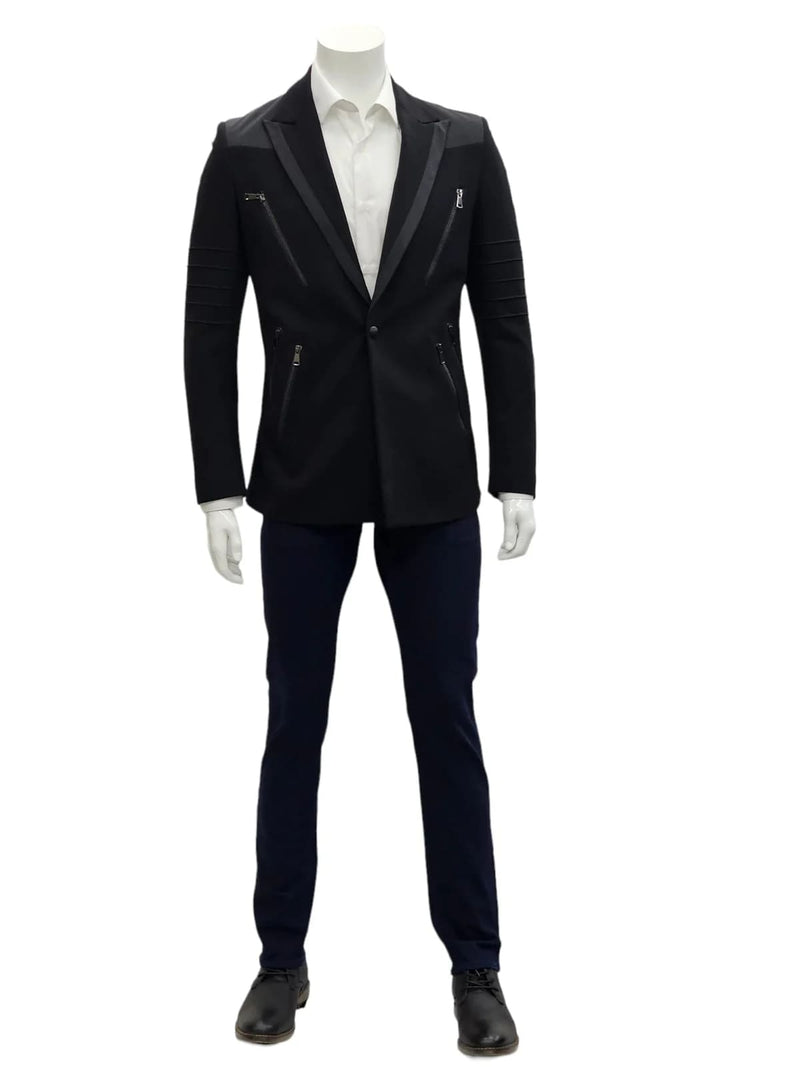 Black slim-fit suit with notch lapels, structured shoulders, and zippered pockets. Minimalist design. Worn with a white shirt and navy trousers. Tailored silhouette.