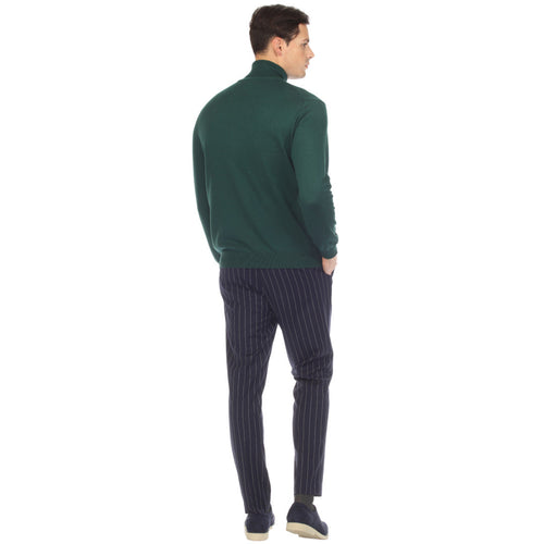 Hunter green men's turtleneck sweater. Fitted silhouette with a snug, tall turtleneck. Knit material. Deep green hue. Ribbed hem and cuffs for a seamless look.