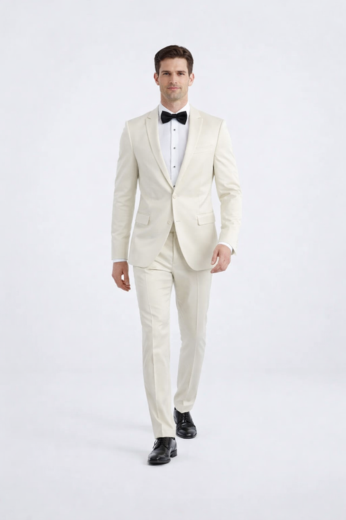 Ivory peak lapel slim fit tuxedo. Fitted silhouette, structured design, smooth ivory fabric. Single-breasted jacket, peak lapel, button closure, two pockets. Straight-leg trousers. Includes white shirt, black bow tie.