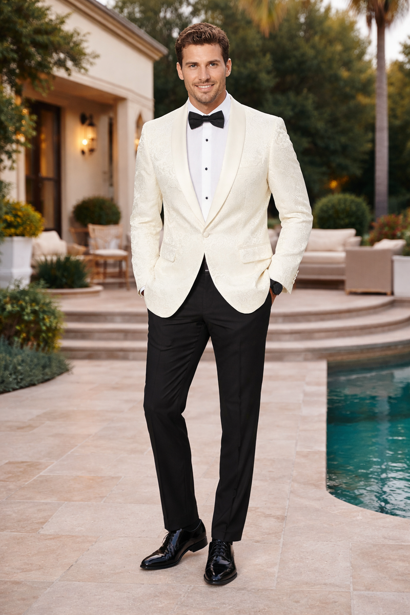 Ivory paisley tuxedo jacket by Alberto Nardoni. Structured silhouette, single-button closure, peaked lapels. Subtle ivory paisley fabric, black buttons. Two front pockets, lined, tailored fit. Pairs with black trousers.