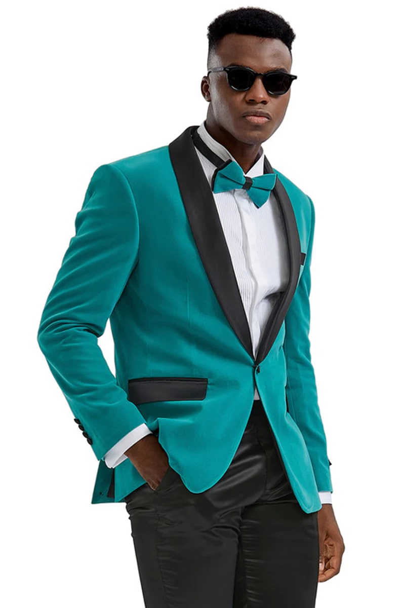 Men's slim-fit teal velvet tuxedo jacket. Shawl lapel with black detailing. Soft, textured fabric.