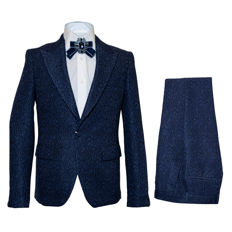 Navy seersucker suit with peak lapels, matching trousers, and a textured, subtle floral pattern. Features a single-button jacket with two front pockets.