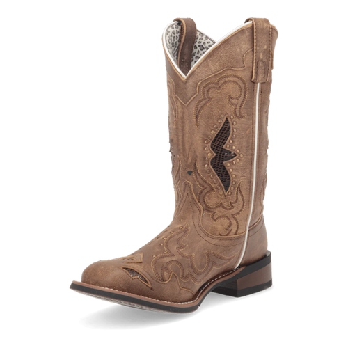 Laredo Women's Spellbound Boot: Tall, structured light brown boot with pointed toe. Darker stitching, zigzag cutouts, and embossing. Patterned lining and stacked heel.