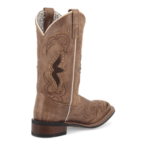 Laredo Spellbound women's boot: tall, brown suede-like shaft, pointed toe, structured design. Intricate stitching & cutouts. White piping detail. Low stacked heel. Patterned interior lining. Classic silhouette.
