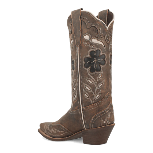 Brown leather Laredo Zuri boot with embroidered floral design and decorative cutouts. Features a pointed toe, block heel for stability, and a tall, tapered silhouette.