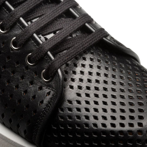 Mezlan Luce black leather sneakers: sleek design with textured, perforated upper. Black leather with black laces, silver eyelets. Light gray midsole for contrast.