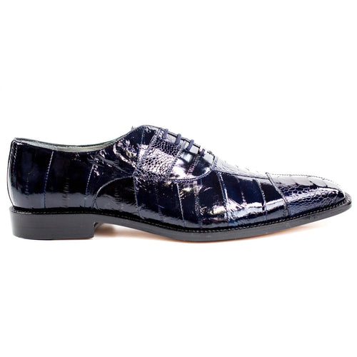 Men's Belvedere Mare navy dress shoe. Ostrich leg and eel skin blend with a pointed toe and shiny finish. Features textured design, structured silhouette, lace-up front, and a flat, rounded sole.