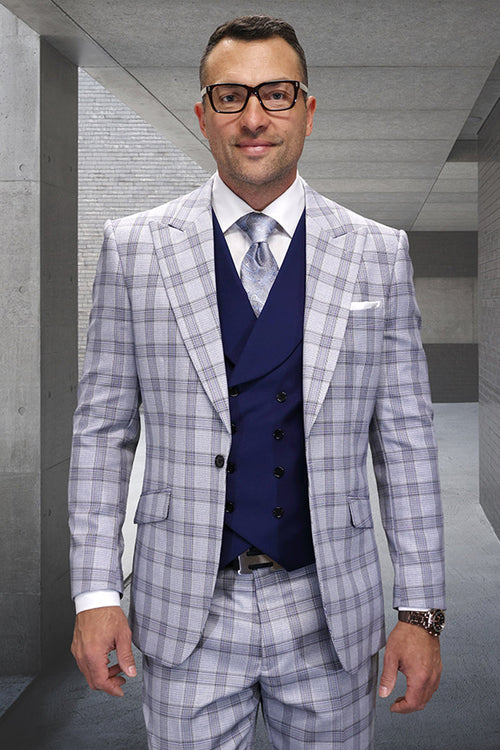 Men's designer wool suit with grey windowpane plaid. Includes navy double-breasted vest. Features tailored fit, structured lapels, and matching plaid trousers. Wool blend.