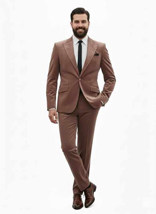 Men's mauve velvet suit. Ultra-slim fit light brown blazer with classic lapel, single-button closure, and two pockets. Matching tailored, streamlined pants complete the look.
