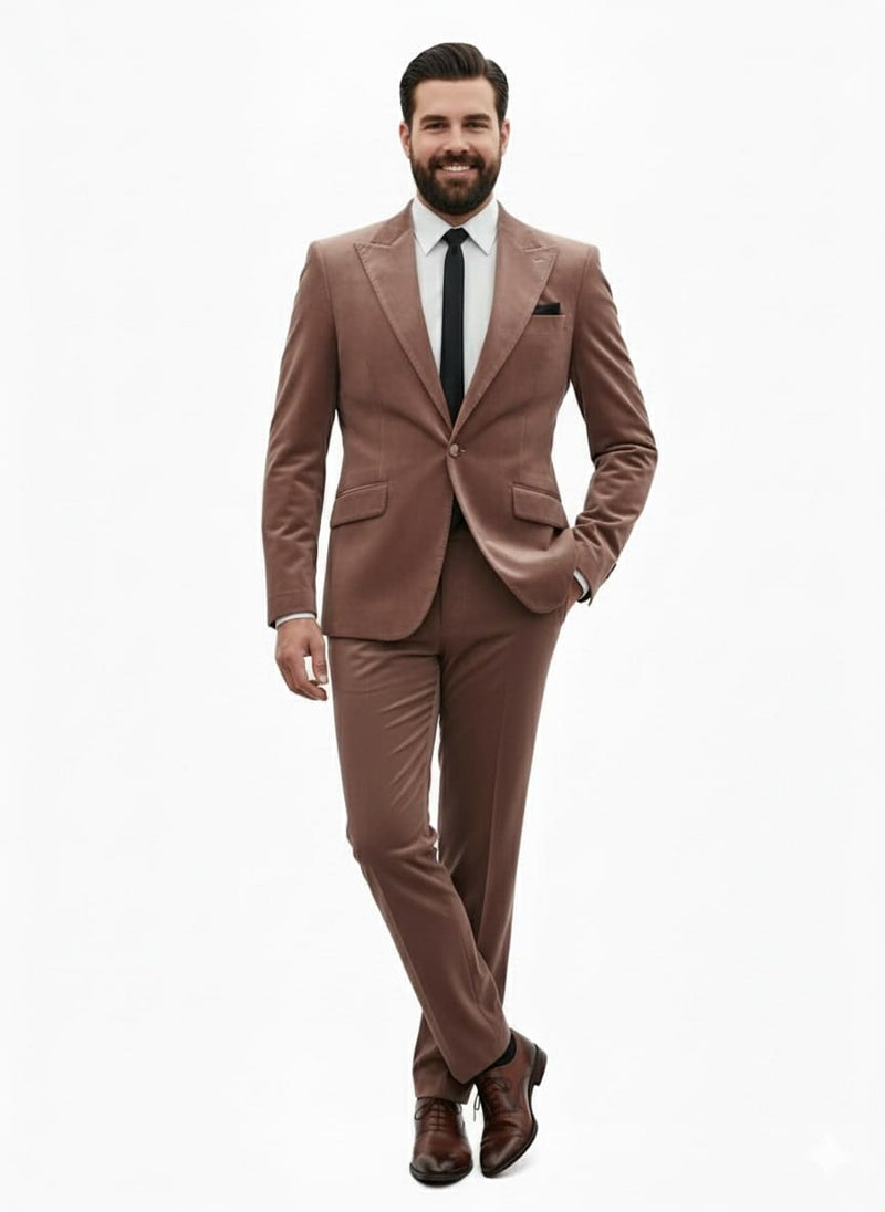 Men's mauve velvet suit. Ultra-slim fit light brown blazer with classic lapel, single-button closure, and two pockets. Matching tailored, streamlined pants complete the look.