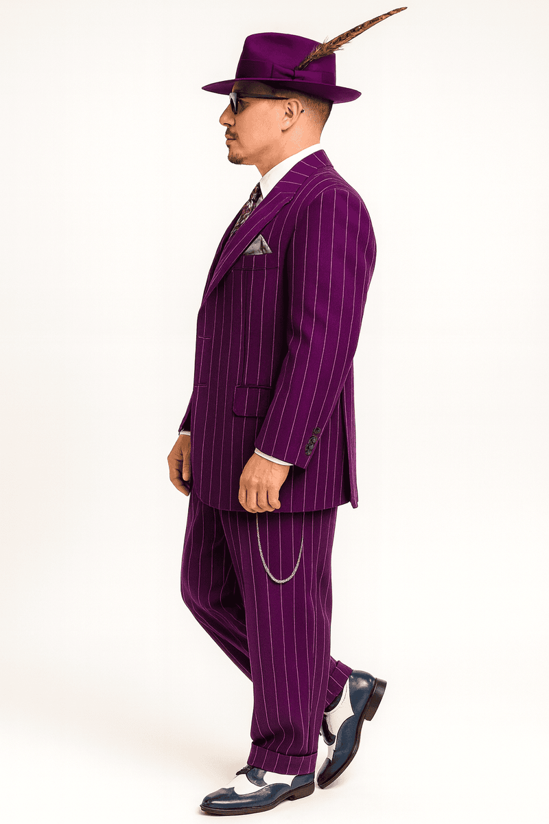 Purple three-piece zoot suit: long jacket with notched lapels & pinstripes, vest, and matching pants. Wide lapels, pocket square, chain detail. Purple hat with a feather completes the look.