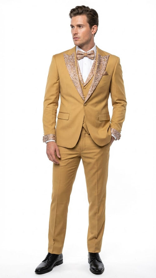 Alberto Nardoni men's gold tuxedo: fitted, single-breasted jacket with ornate embellishments on shawl collar and cuffs. Matching trousers, chest pocket, three-button closure, and gold bow tie. Smooth, subtly shiny fabric.