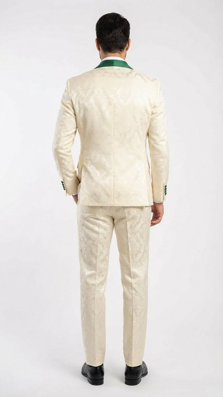 Ivory & emerald green jacquard tuxedo suit. Tailored silhouette, glossy ivory jacket with emerald green collar. Straight-cut pants match the pattern, paired with black shoes. Distinctive design.