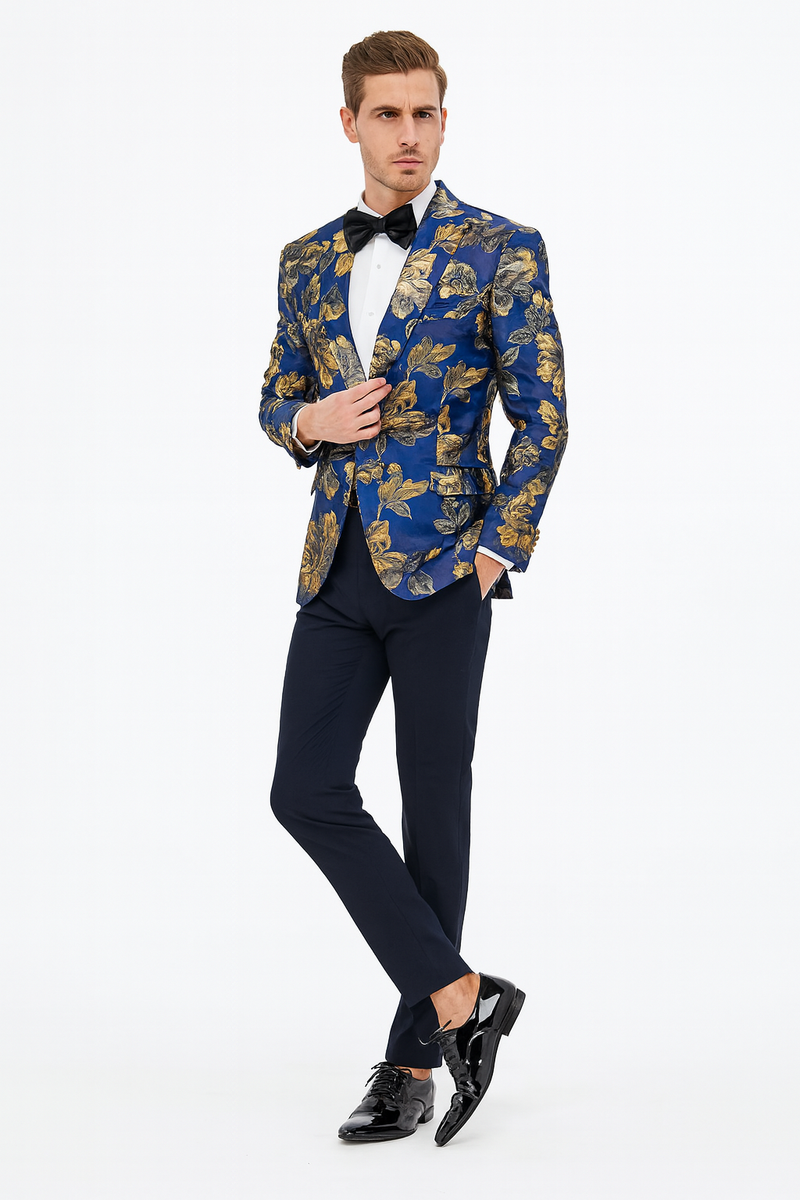 Navy slim-fit men's tuxedo jacket with gold floral paisley. Includes matching bowtie. Structured form, single-button closure. Smooth, luxurious fabric; navy and gold contrast.