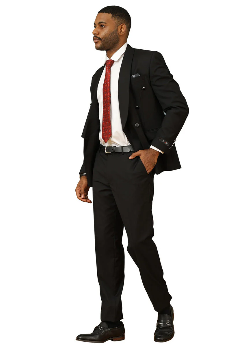 Men's modern fit black double-breasted suit with shawl lapel. Tailored jacket, structured shoulders, fitted design. Matching trousers. Smooth, slightly shiny fabric. Red tie, pocket square, and polished black shoes complete the look.