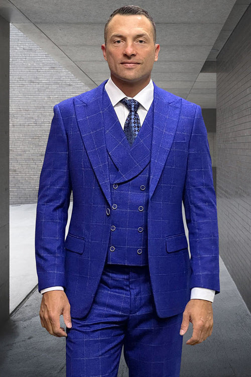 Men's cobalt blue wool suit with windowpane plaid. Double-breasted vest, structured jacket, textured fabric. Light shirt, patterned tie complete the stylish ensemble.