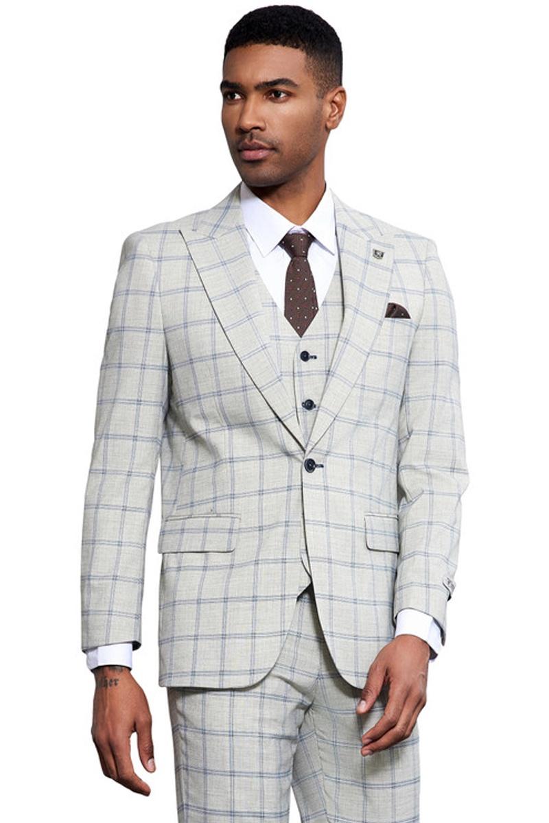 Stacy Adams men's suit: one-button, peak lapel, vested. Grey and blue windowpane plaid. Tailored fit with structured jacket, matching vest, and trousers. Textured fabric design.