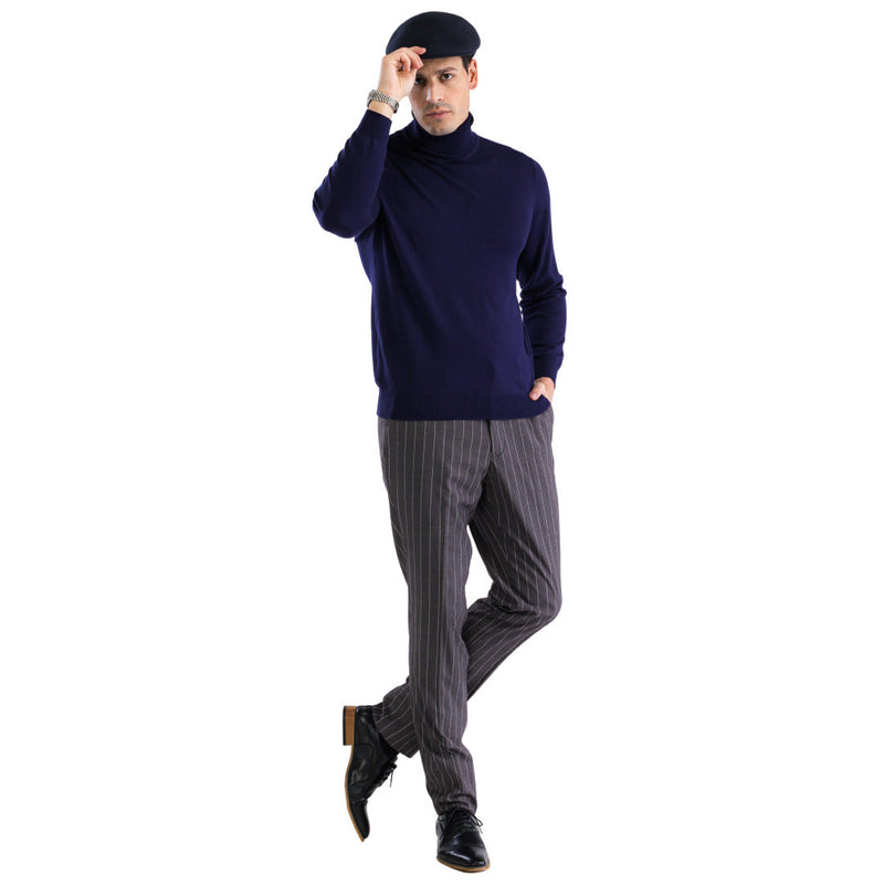 Men's navy turtleneck sweater with a snug fit. Features long sleeves, ribbed hem, and a soft, smooth texture. Classic, solid navy color.