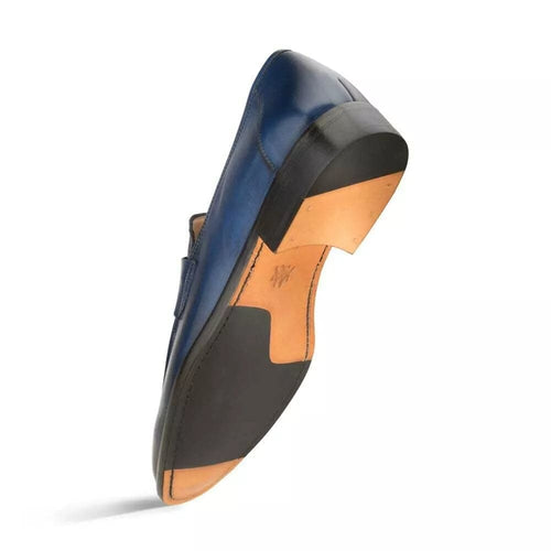 Navy burnished calfskin penny loafer by Mezlan. Sleek, curved shape with raised heel. Smooth navy leather upper with a classic penny slot. Leather and black rubber outsole for durability.