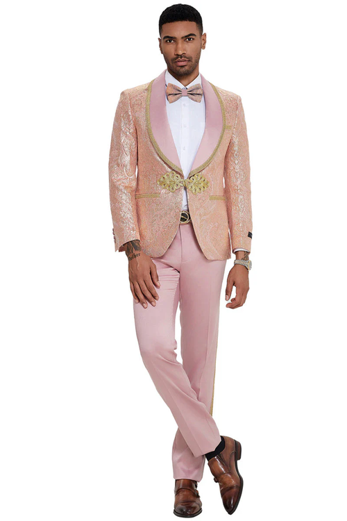 Men's pink paisley tuxedo with shawl lapel. Fitted, textured jacket with floral pattern and satin lapel. Matching light pink trousers. Decorative closure.