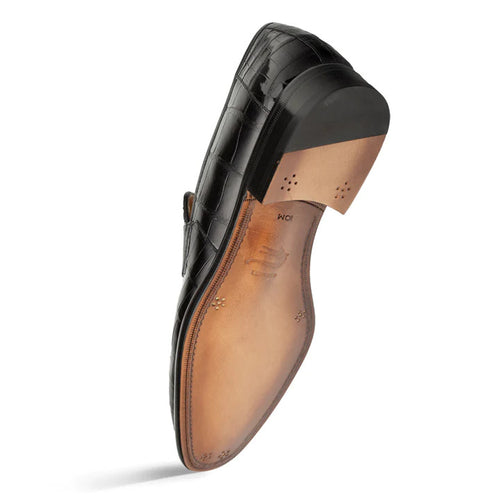 Black Piccolo penny loafer in genuine alligator leather. Glossy finish, classic shape with rounded toe and penny slot. Black heel, tan leather sole with perforations.