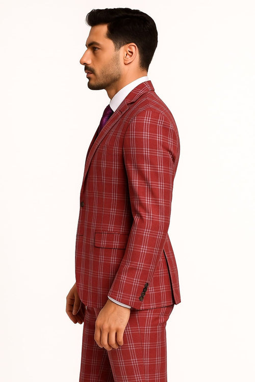 Red plaid three-piece men's suit: blazer (2 buttons, notched lapel, pockets), vest, tailored pants. Bold checkered pattern, structured fit, smooth fabric. Red base with white & darker plaid.