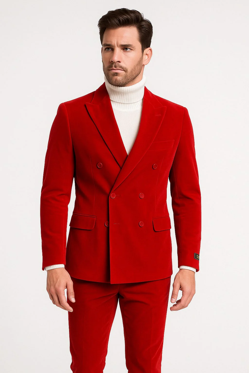 Men's slim fit red velvet double-breasted suit. Peak lapel, smooth velvet. Features a tailored silhouette, structured jacket, padded shoulders, fitted sleeves, and matching slim trousers.
