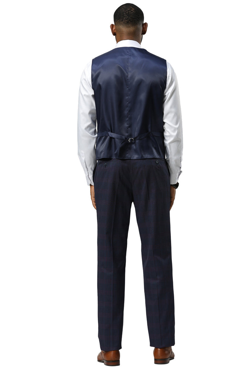 Navy glen plaid Stacy Adams suit. One-button peak lapel. Includes vest with adjustable back and contrasting white shirt. Matching trousers in a slightly different shade. Structured shoulders.