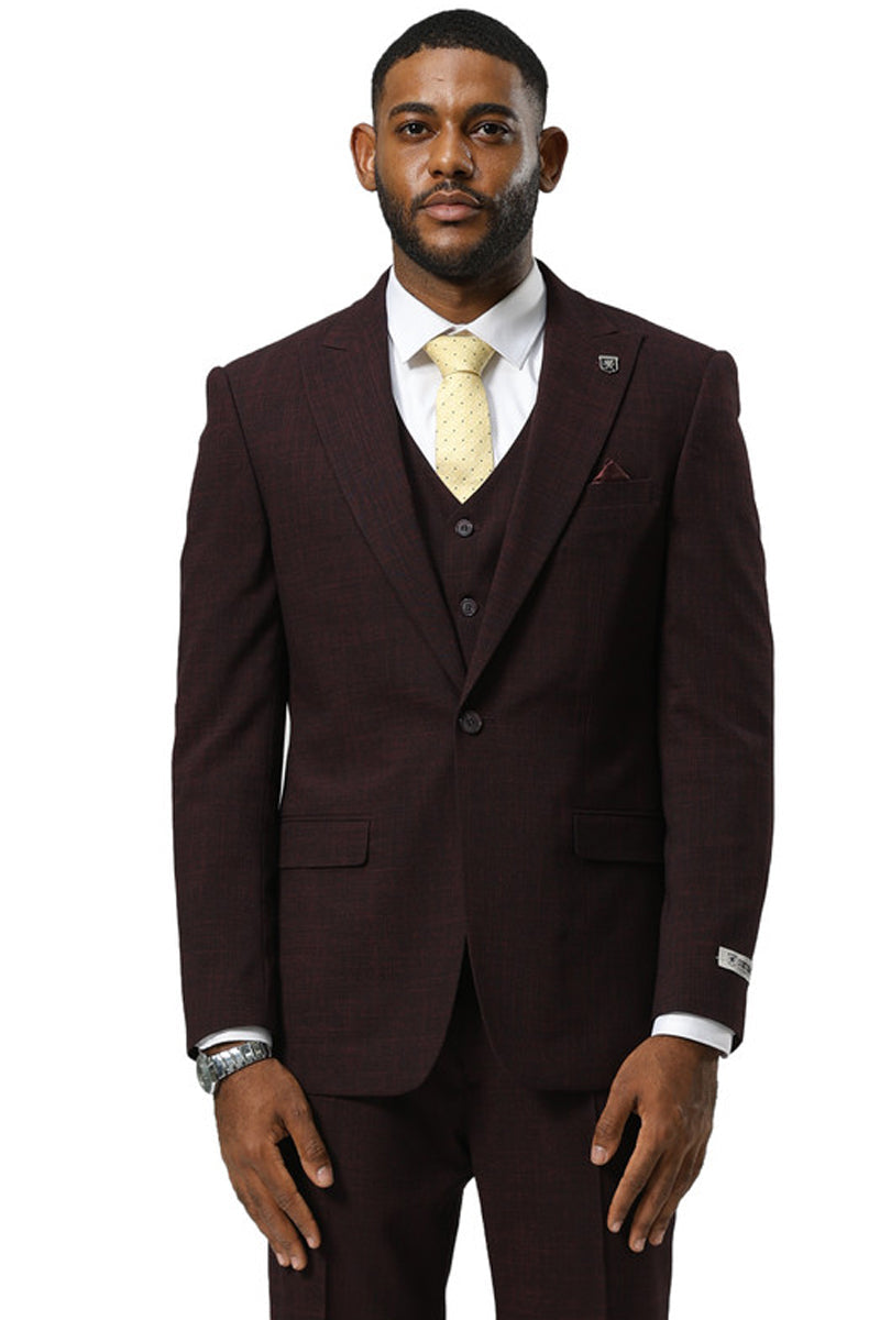 Burgundy Stacy Adams men's suit with a sharkskin pattern. Features a fitted, one-button jacket with peak lapels, matching vest, and flap pockets. Shown with white shirt and yellow tie.